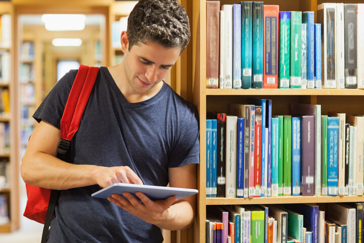 male student in library